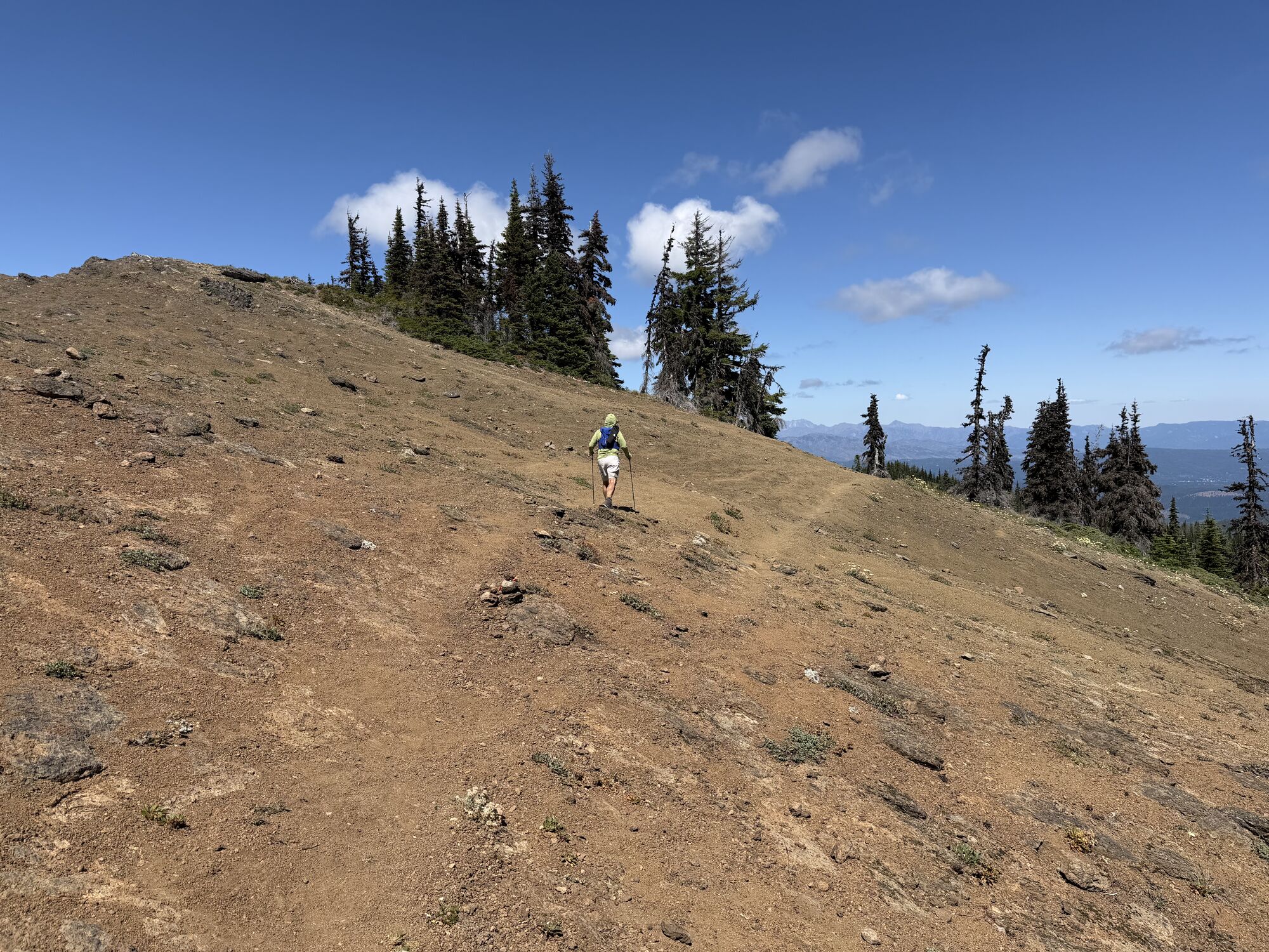 Wade climbing the exposed slope of Goat Peak late in the race
