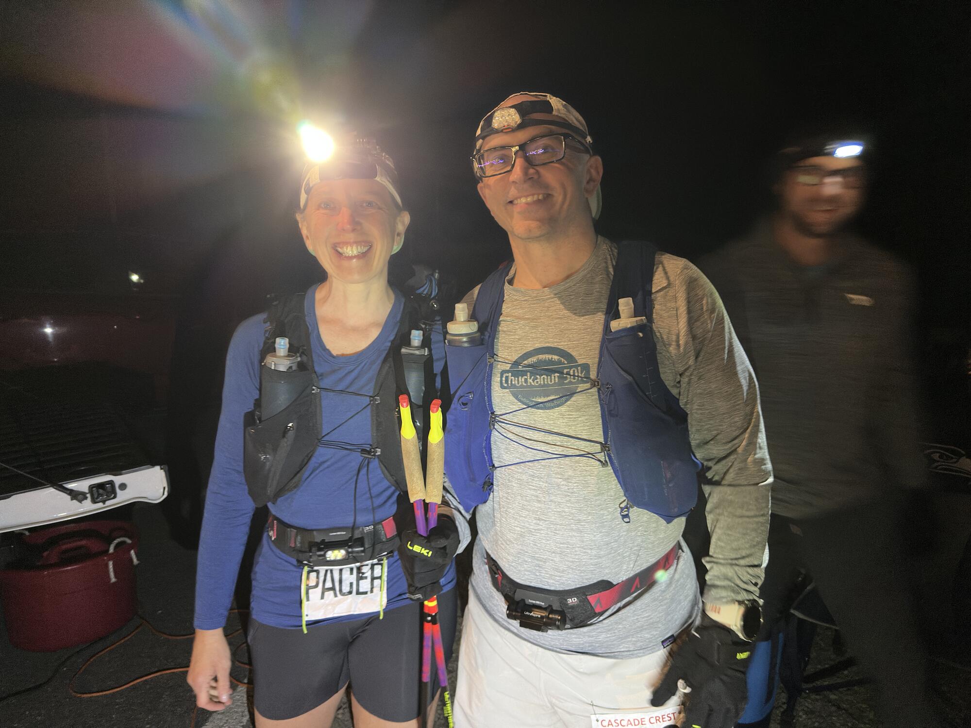 Wade and Tori wearing headlamps at Hyak before starting the return leg